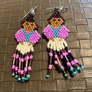 Beaded pierced earrings of a lady
